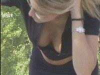 Our hunter recorded the sweet blonde cooling down in a hot summer day and unwillingly exposing her downblouse view!